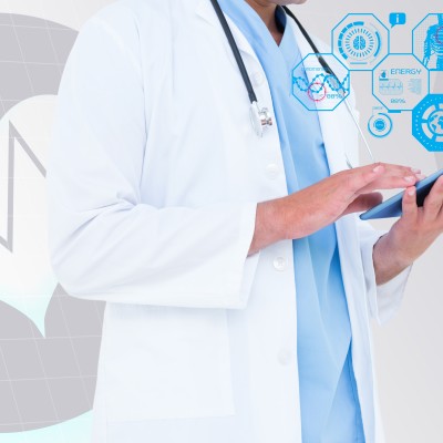 composite image of doctor using digital tablet